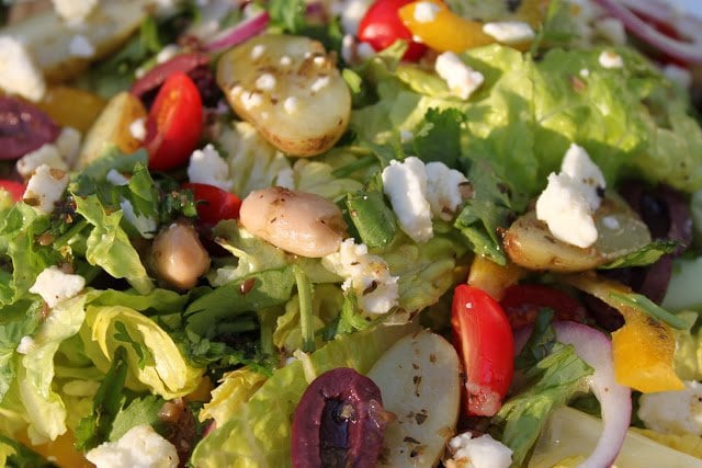 Greek Salad - a delicious classic Greek salad with an equally classic salad dressing to boot! The flavors are fantastic; and so versatile!