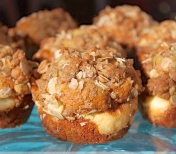 Banana Crunch Muffins - Delicious banana muffins with a buttery cinnamon crumb topping and a delightful cream cheese surprise in the center.