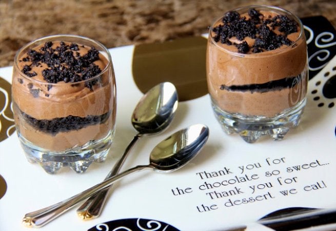 Photo of two glass serving cups filled with Bailey's Irish Cream French Silk on a brown and white serving tray with "Thank you for the chocolate so sweet... Thank you for the dessert we eat!"