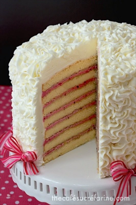 Seven Layer Lemon Cake with Blackberry Buttercream Filling - this stunning layer cake is absolutely a show stopper for your next special occasion. With the blackberry buttercream filling, it tastes even better than it looks!