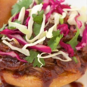 Rosemary Root beer Slow Cooked Pork - unique and crazy good, this stuff is a real crowd pleaser. The honey-lime slaw takes it right over the top!
