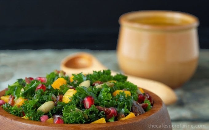 Massaged Kale and Butternut Squash Salad with Warm Apple Cider Dressing - an amazingly healthy, flavorful fall salad with kale, pomegranates, roasted squash and onions, all topped off with a delicious apple cider-bacon dressing. What's not to love?