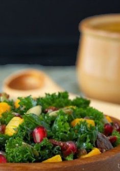 Massaged Kale and Butternut Squash Salad with Warm Apple Cider Dressing - an amazingly healthy, flavorful fall salad with kale, pomegranates, roasted squash and onions, all topped off with a delicious apple cider-bacon dressing. What's not to love?