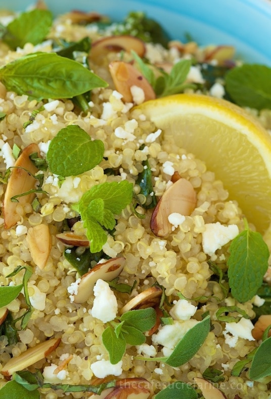Lemon Quinoa Salad is a fresh, healthy salad with a lemony vinaigrette, baby spinach, fresh herbs, crumbled Feta, and a  shower of toasted butter almonds.
