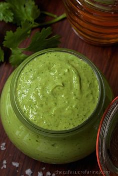 Vertical overhead picture of avocado crema in a glass jar