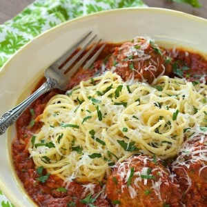 Vertical picture of Italian Meatballs and Marinara in a white bowl
