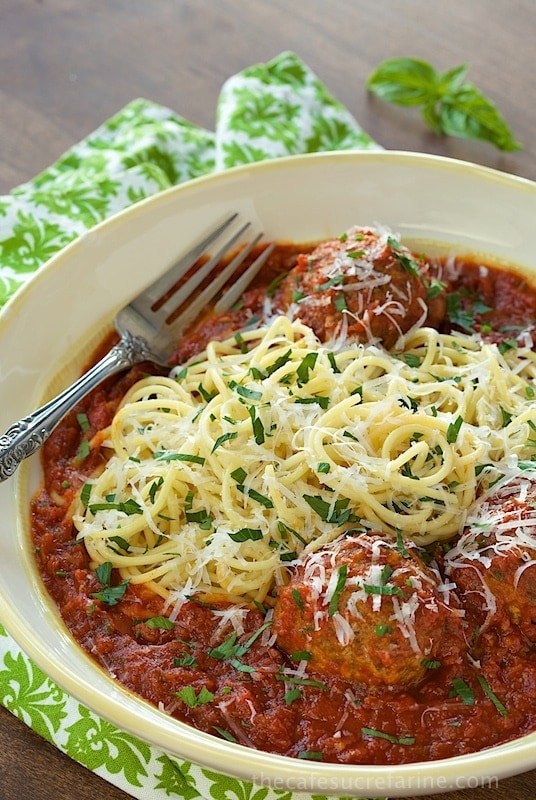 Vertical picture of Italian Meatballs and Marinara in a white bowl