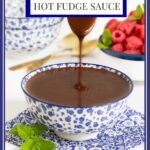 Vertical closeup photo of a person pouring Ridiculously Easy Hot Fudge Sauce into a bowl of the sauce.