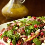 Arugula, Pear and Pom Salad - a fabulous fresh salad with fresh pears, pomegranate arils and juicy red grapes. A poppy seed and apple cider dressing is the perfect pairing!