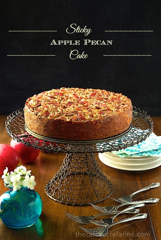Sticky Apple Pecan Cake - this moist, buttery autumn-inspired confection is loaded with apples in the fabulous warm-spiced cake, as well as adorning the luscious pecan topping. Just before it emerges from the oven, it's brushed with a sweet, sticky, maple glaze, making it beyond irresistible! 