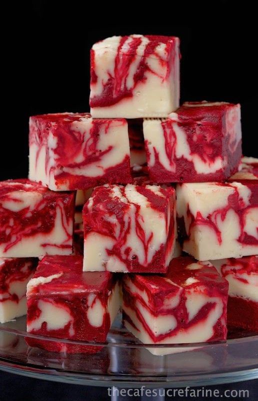 Picture of Winter White Red Velvet Fudge stacked on a clear stand