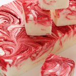 Strawberry Swirled Fantasy Fudge - totally mind blowing fudge! It's creamy with flecks of vanilla bean and swirled with strawberries. Makes a lovely gift if you can get it out of the house! It disappears right before my eyes when I make it!