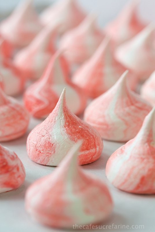Red Velvet Meringue Kisses - melt in your mouth meringue kisses with a delightful touch! The stripes have the delicious essence of Red Velvet!