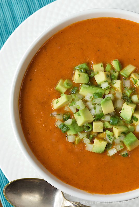 Southwestern Tomato and Roasted Red Pepper Soup - hearty, healthy and super flavorful, this soup is loaded with lots of great veggies and a burst of south-of-the-border flavor. The avocado salsa takes it right over the top!