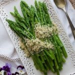 Overhead picture of Asparagus with Lemon Parsley Panko on a white platter