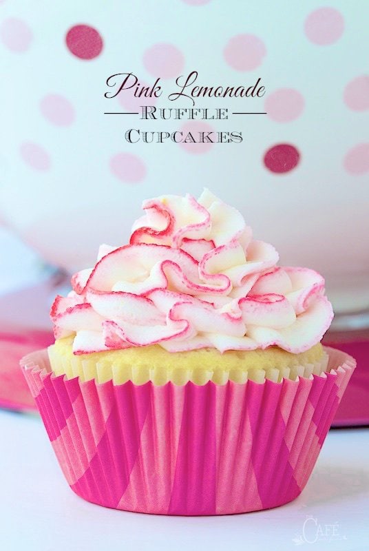 Pink Lemonade Ruffle Cupcakes - Super moist, lemony cupcakes studded with bits of delicious raspberry - a flavor match made in heaven! Oh and the crème de la crème? A super fun, crazy good lemon buttercream ruffles tinged with pink (or any color you choose).