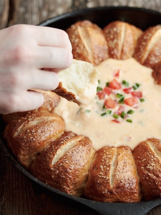 Warm Pretzel Rolls with Mexican Cheese Dip - I can only imagine how fast this beautiful dish would disappear at a party or get together! 