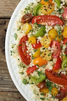 Ottolenghi's Tomato Party Couscous Salad - quintessentially summer, this fun pasta salad is delicious, healthy and make-ahead. It's perfect for pot lucks, parties and picnics.
