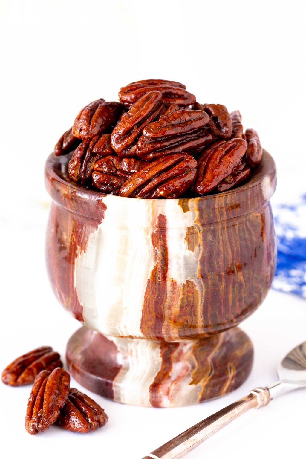 Vertical picture of Maple Molasses Glazed Pecans in a stone bowl