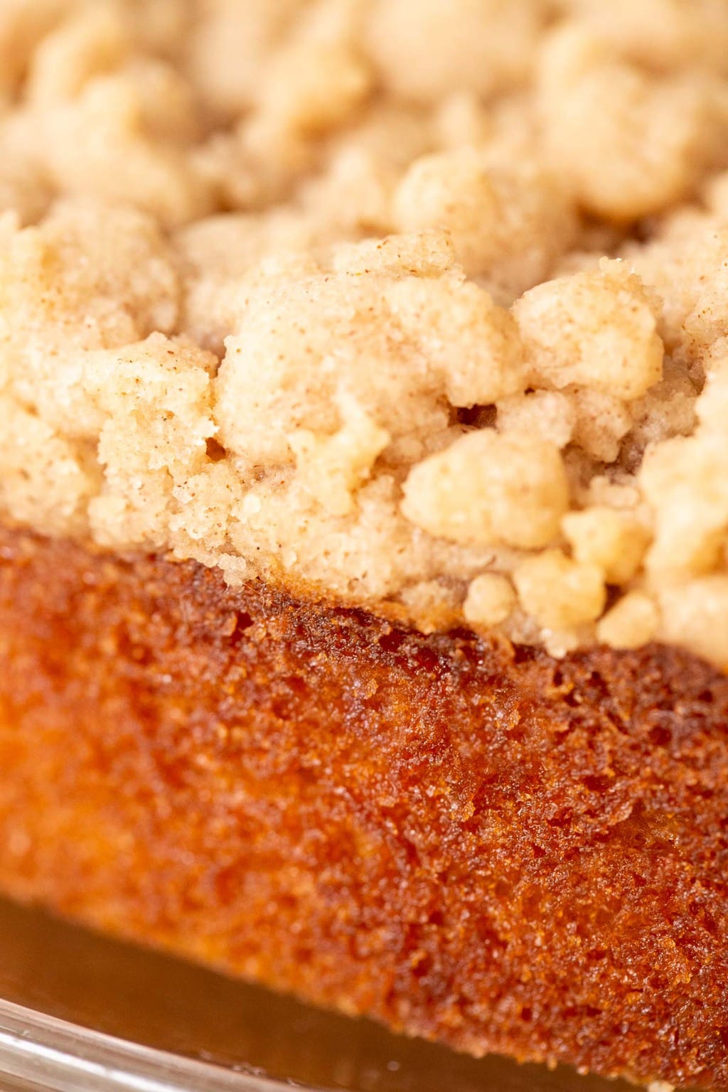 Vertical extreme closeup photo of the side and top crumble of an Easy Overnight Coffee Cake.