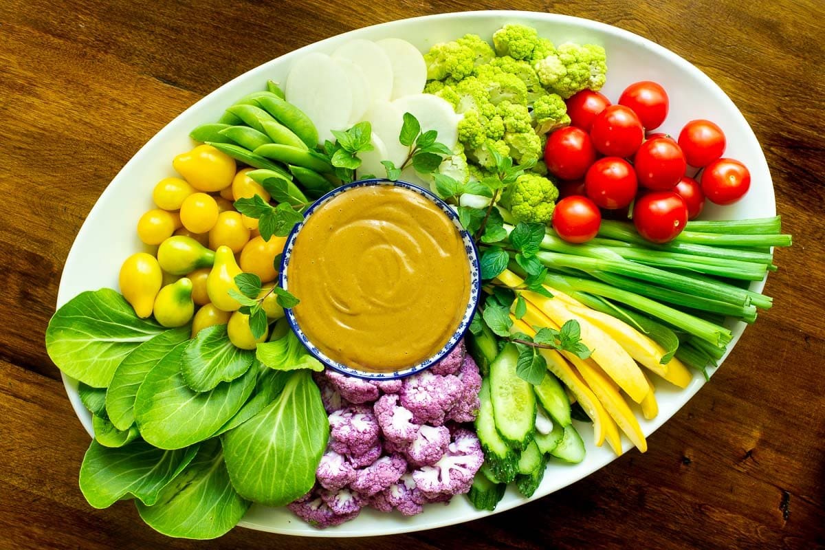 Horizontal overhead photo of an appetizer plate featuring 5 Minute Easy Peanut Sauce.