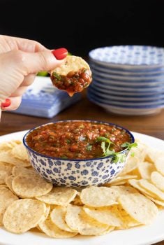 Vertical picture of Best Ever, Super Easy Salsa with chips and a blue and white bowl