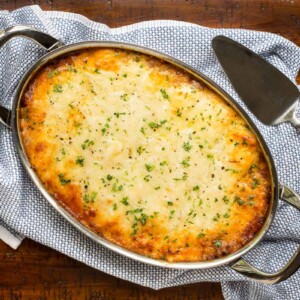 Horizontal overhead photo of a baking pan of Make Ahead Homemade Manicotti.