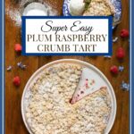 Vertical overhead photo of a Easy Plum Raspberry Crumb Tart on a wood table.