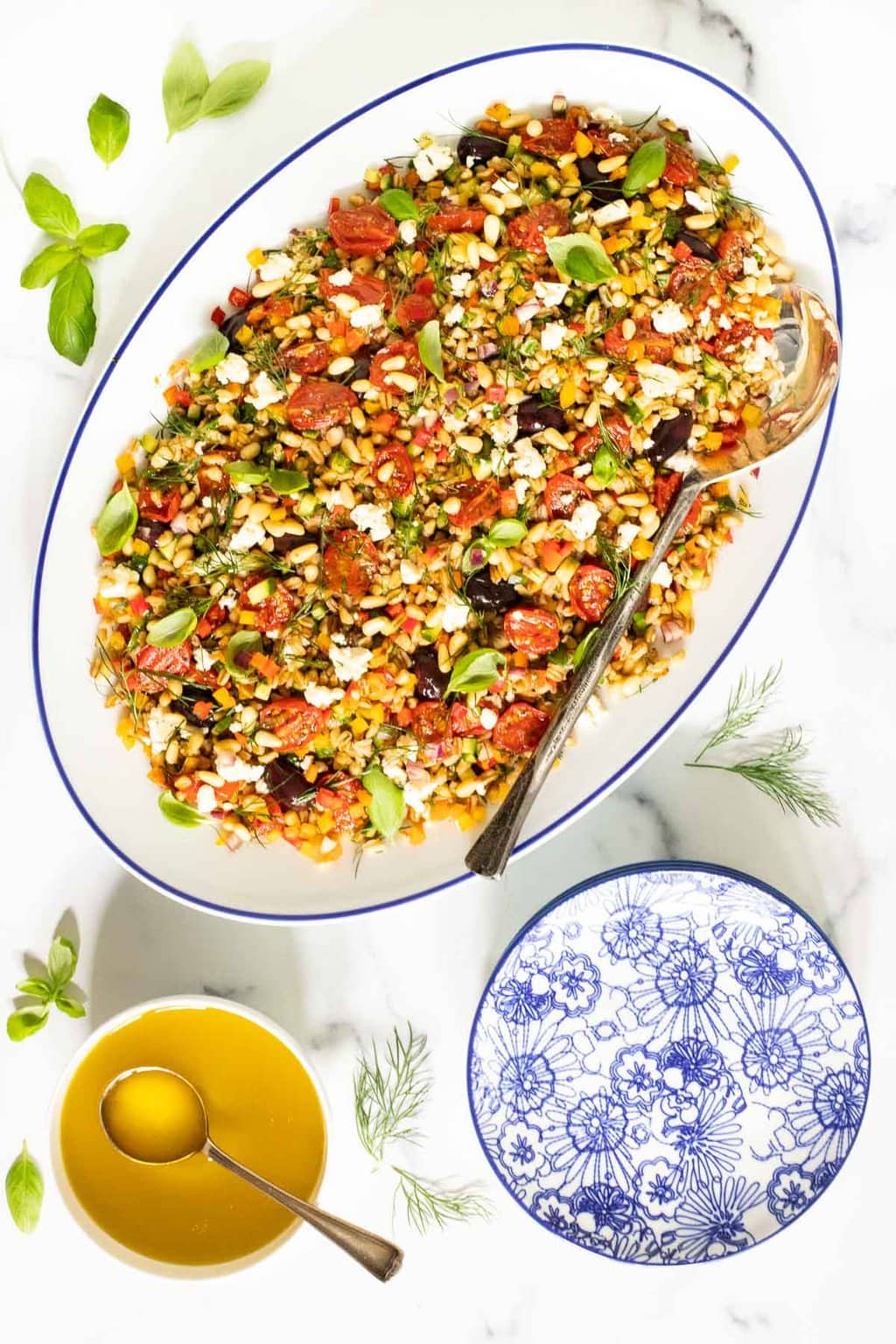 Vertical overhead photo of a platter of Chopped Mediterranean Farro Salad.