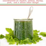 Vertical photo of a Weck glass jar filled with Italian Mint Pesto surrounded by fresh mint leaves with a word graphic at the top of the photo.