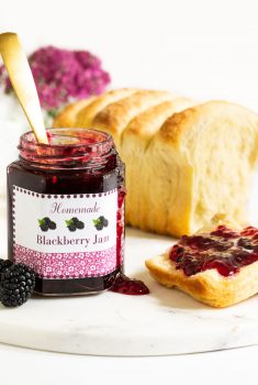 Vertical picture of Blackberry Jam in a jar and spread on toast