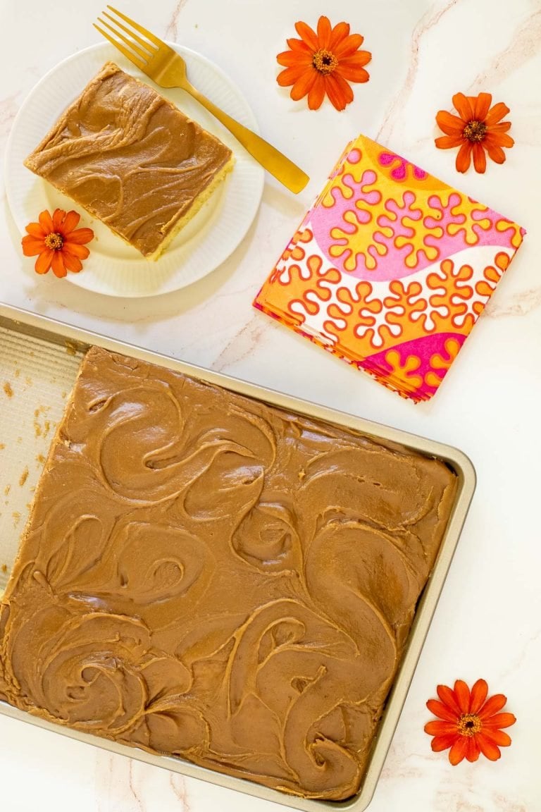 Vertical overhead picture of Caramel Buttermilk Sheet Cake in a pan and cut into slices