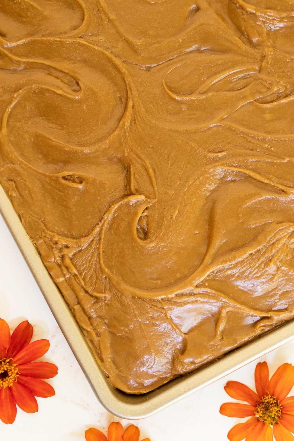 Overhead vertical photo of a Ridiculously Easy Caramel Buttermilk Sheet Cake with caramel icing.