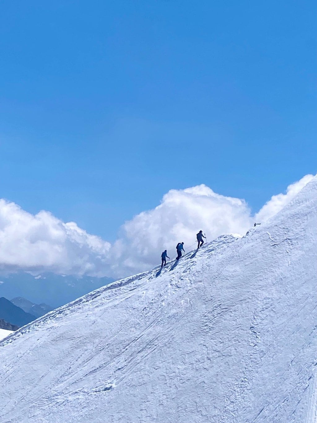 Horizontal photo of mountain climbers near the Aiguille du Midi near Chamonix, France.