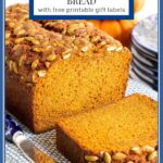 Vertical closeup photo of a loaf of Better than Starbuck's Pumpkin Bread with a rectangular title box at the top of the photo.