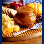 Vertical closeup photo of a fall appetizer tray featuring Pumpkin Jam.