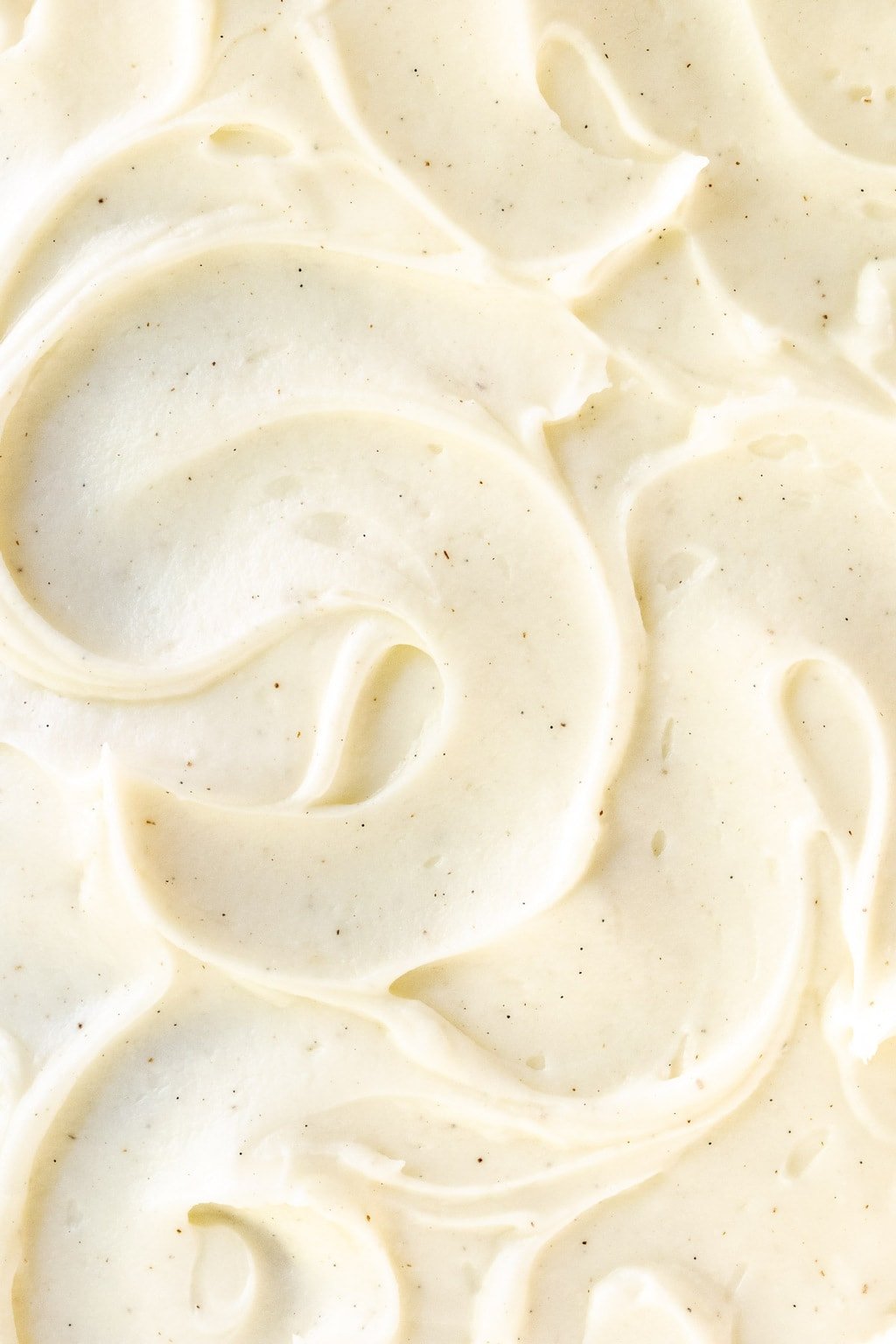Extreme closeup photo of the vanilla beam buttercream frosting used on this Ridiculously Easy Applesauce Sheet Cake.