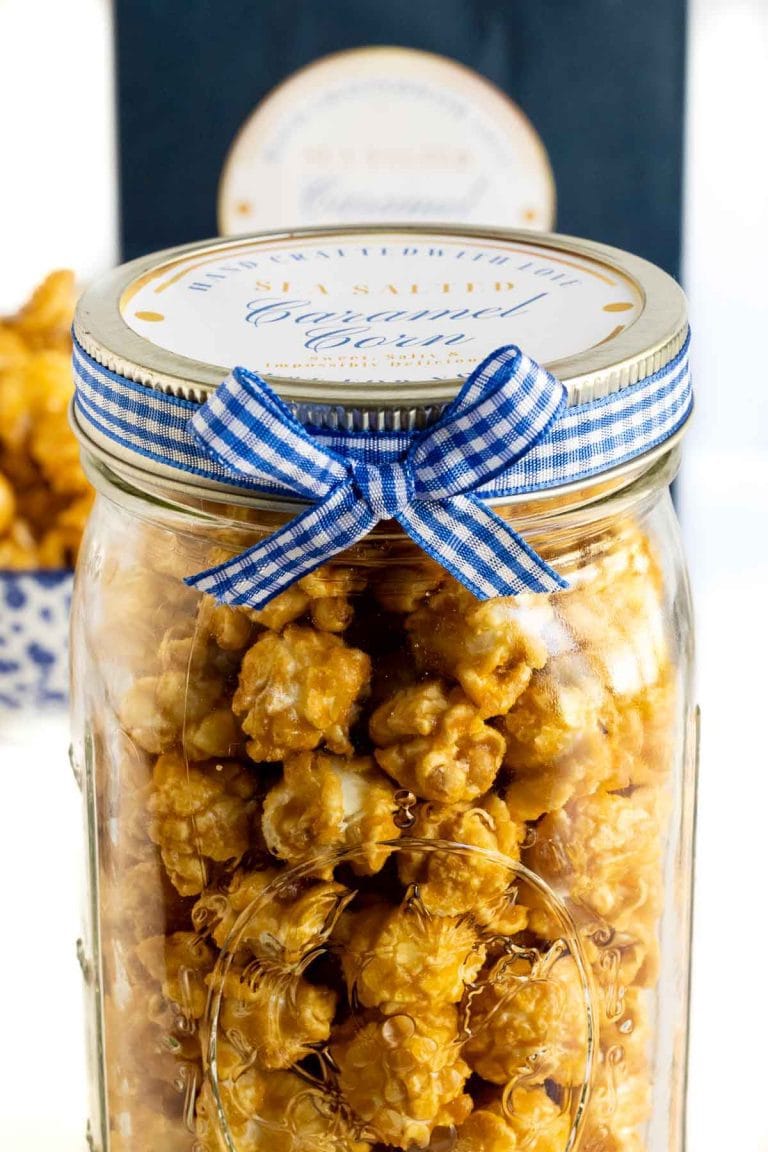 Vertical picture of Sea Salted Caramel Corn in a glass jar with a gift label