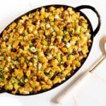 Horizontal overhead photo of a Smithey hammered metal pan filled with Crispy, Buttery Herb Stuffing.