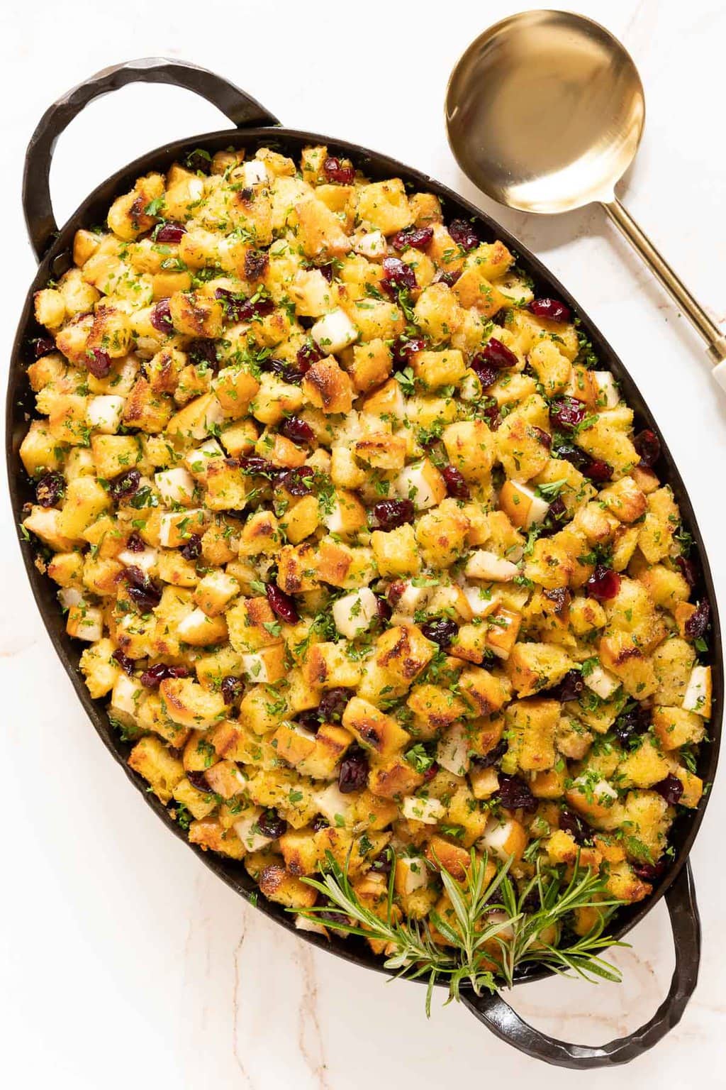 Vertical overhead photo of a pan of The BEST Stuffing Recipe - Crispy, Buttery Herb Stuffing.