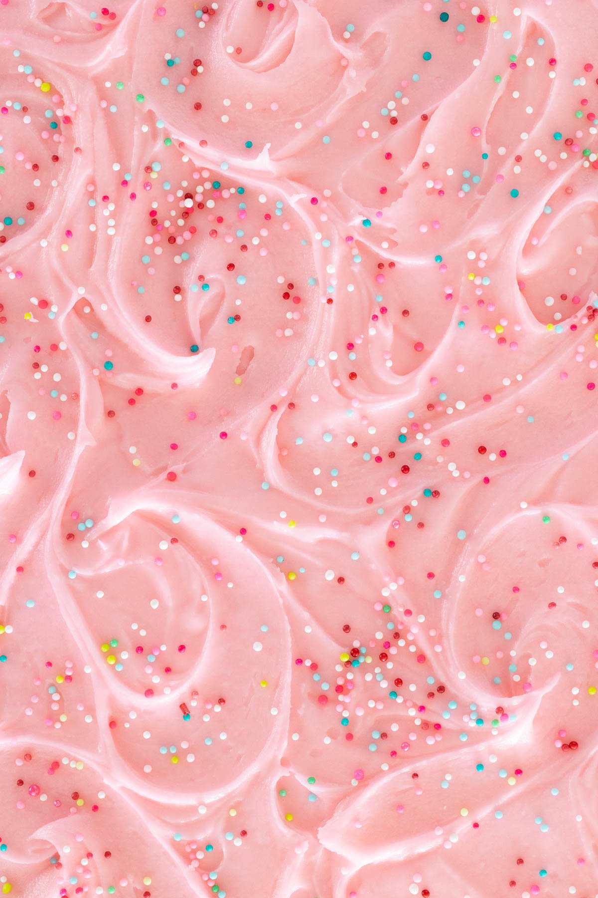 Overhead extreme closeup photo of the frosting of a Ridiculously Easy Funfetti Sheet Cake.