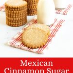 Vertical photo of a batch of Mexican Cinnamon Sugar Shortbread on a red and white patterned napkin with small jars of milk in the background.