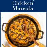 Overhead vertical photo of a black cast iron pan of Weeknight, Dinner Party Chicken Marsala with a graphic word title in a blue background on the top of the photo.