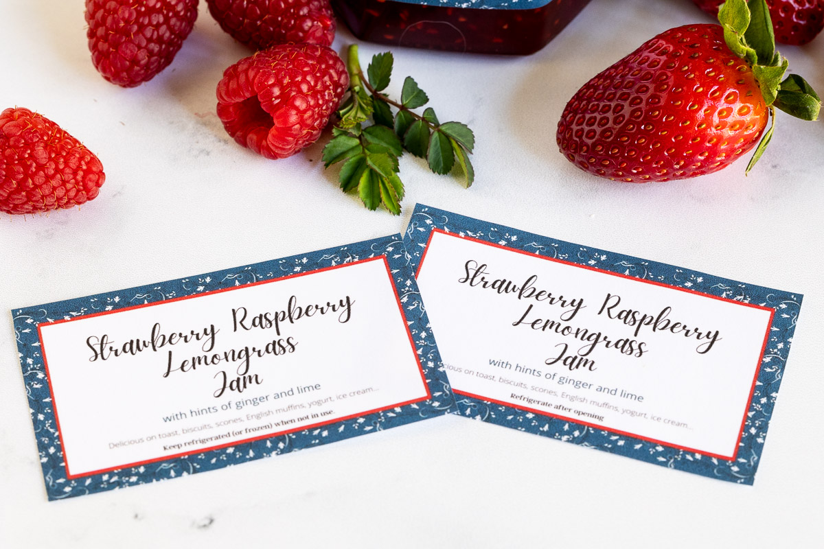 Horizontal closeup photo of custom gift labels for Strawberry Raspberry Lemongrass Jam and regular shelf stable Strawberry Raspberry Lemongrass Jam.