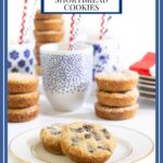 Vertical photo of batch of Peanut Butter Shortbread Cookies with cups of milk and stacks of cookies in the background.
