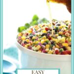 Vertical photo of a white serving bowl of Mexican Corn and Bean Salad with a graphic title at the bottom of the photo.