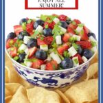 Vertical photo of a bowl of Red, White and Blue Salsa surrounded by tortilla chips.