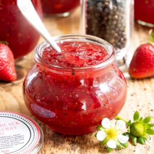 Strawberry Balsamic Black Pepper Jam in a small glass jar.