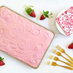 Horizontal overhead photo of a Vanilla Bean Sheet Cake with Fresh Strawberry Icing.