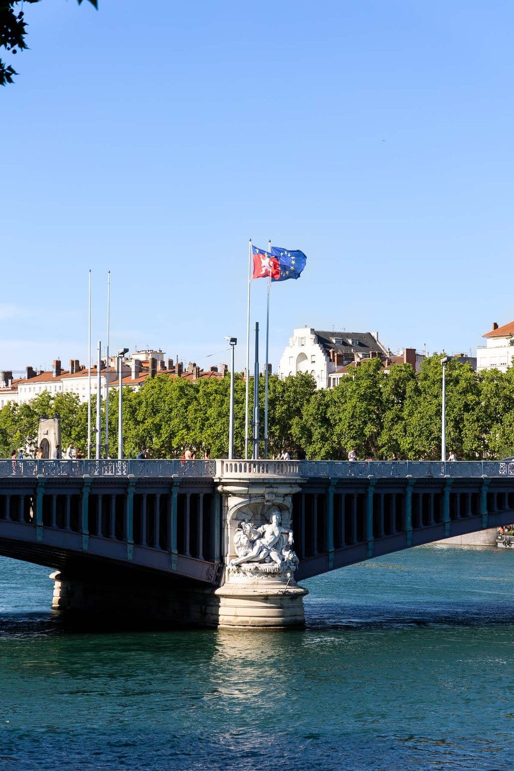 Vertical photo of one of the bridges over the River Rhone in Lyon, France.